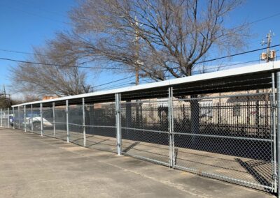 Commercial security chain link fencing with barbed wire topping installed by Advanced Fences for an industrial facility in Texas
