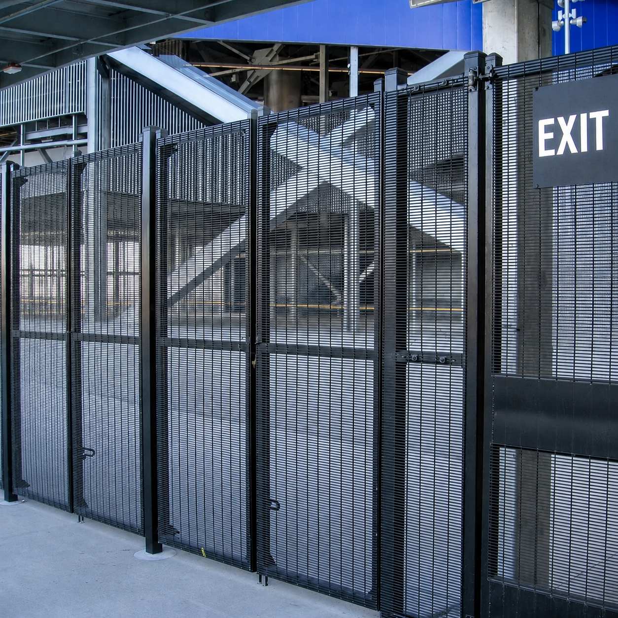 Anti-climb welded mesh security fencing and gates securing a critical-infrastructure facility.