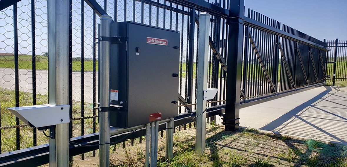 Cantilever slide gate with counterbalance truss and LiftMaster commercial operator.