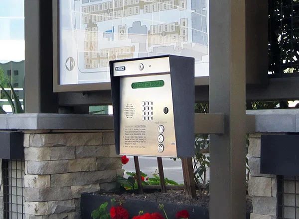 DoorKing 1835 stainless telephone entry system at a community access point.