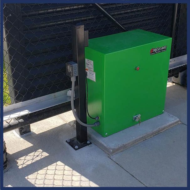 HySecurity commercial gate operator installed at a secured commercial entrance.