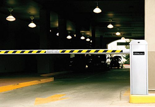 LiftMaster Mega Arm Tower barrier gate operator at a parking garage entrance.